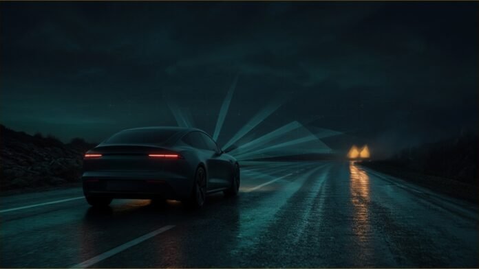 Tesla Driver Says He Was Asleep Before CHP Crash | TSN An electric car on a dark wet highway with sensor beams and an amber glow ahead.